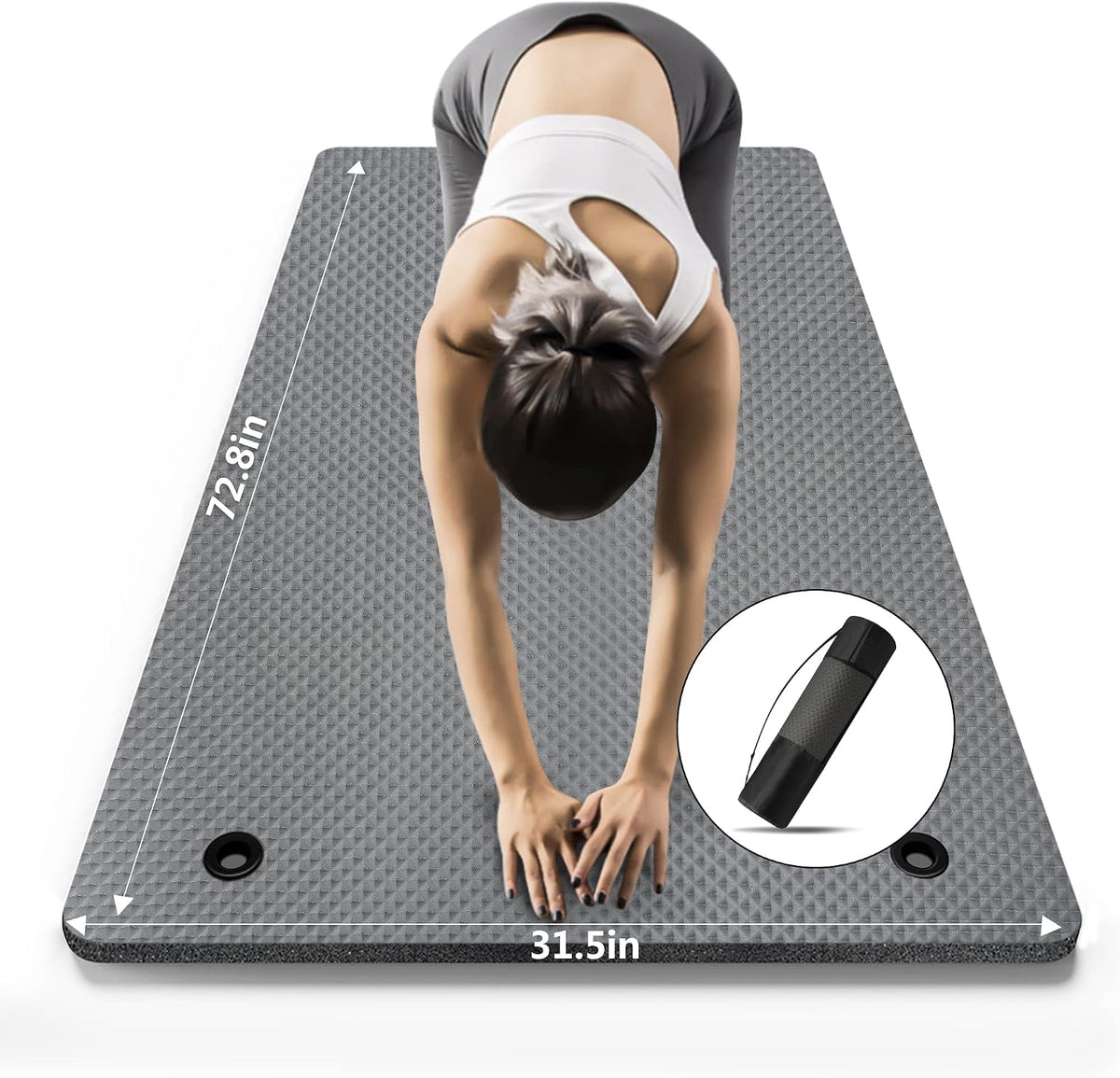 Grey extra-wide textured yoga mat with two hanging holes, shown beneath a woman stretching, with dimension labels and a storage bag inset.
