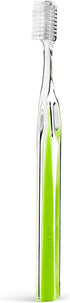 Single soft-bristle manual toothbrush with a transparent-style handle and vibrant green Peridot accent.