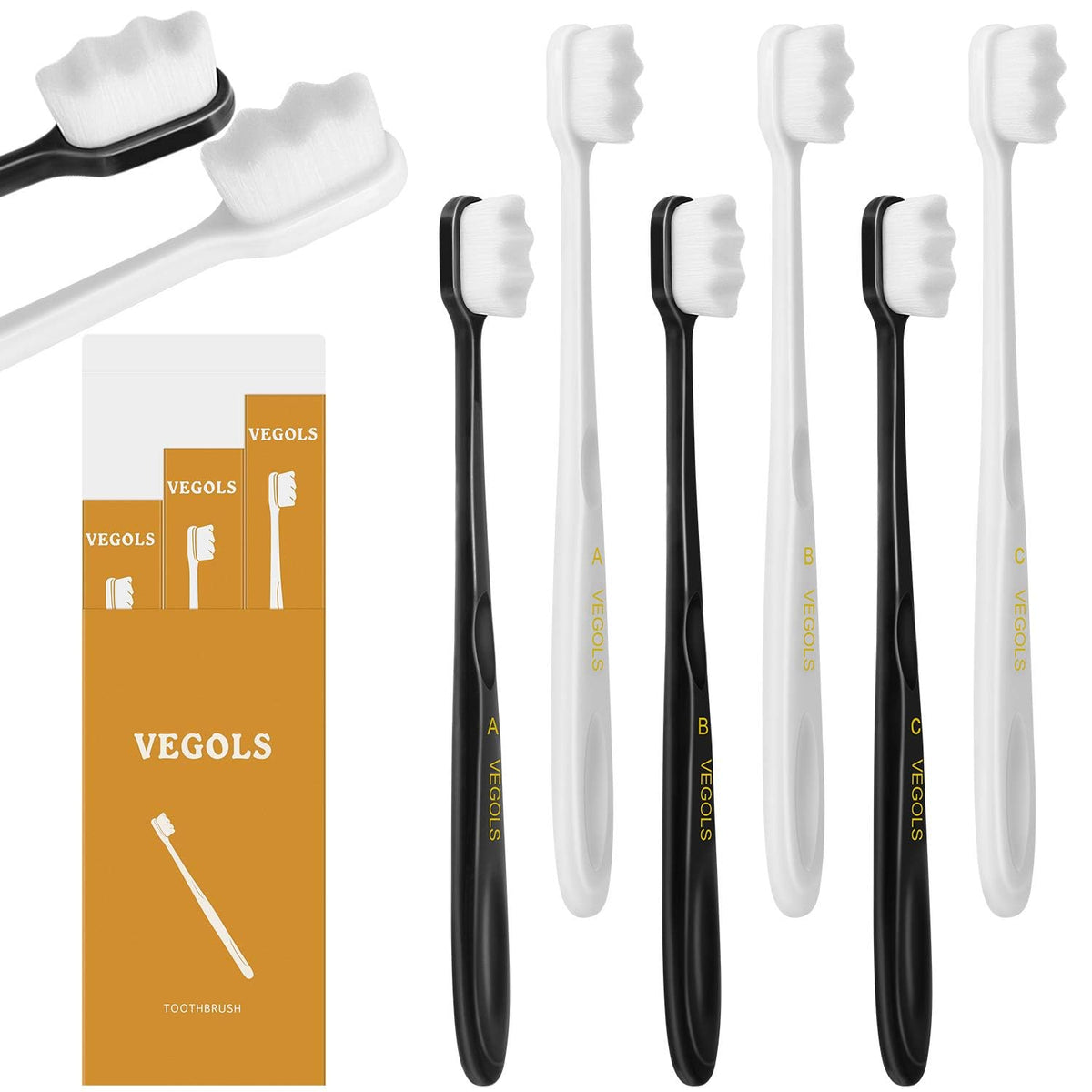 Six ultra-soft manual toothbrushes in black and white with densely packed bristles and ergonomic handles.