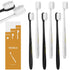 Six ultra-soft manual toothbrushes in black and white with densely packed bristles and ergonomic handles.
