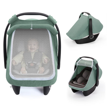Baby car seat with green protective canopy in use