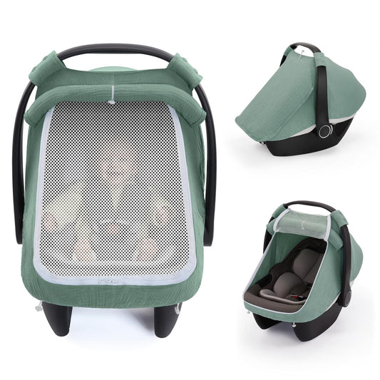 Baby car seat with green protective canopy in use