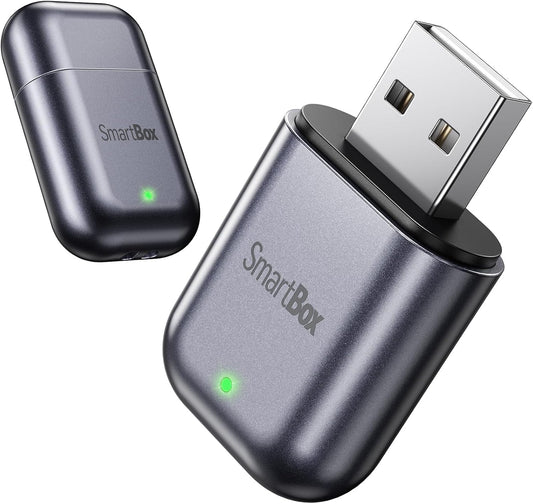 Ultra-mini Bright Gray CarPlay dongle close-up view
