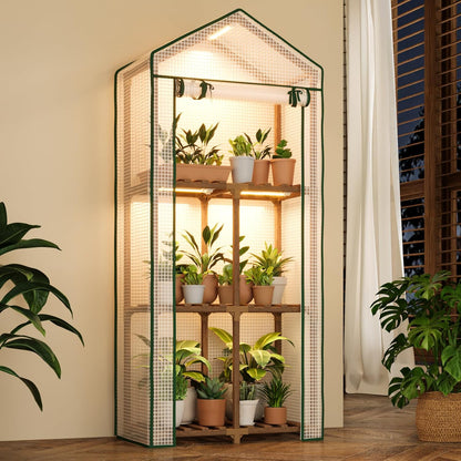 Three-tier wooden mini greenhouse with a polyethylene cover, integrated grow lights, and potted indoor plants.