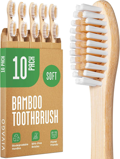 10-pack of soft bristle bamboo toothbrushes for adults with natural wooden handles, white and beige nylon bristles and kraft packaging.